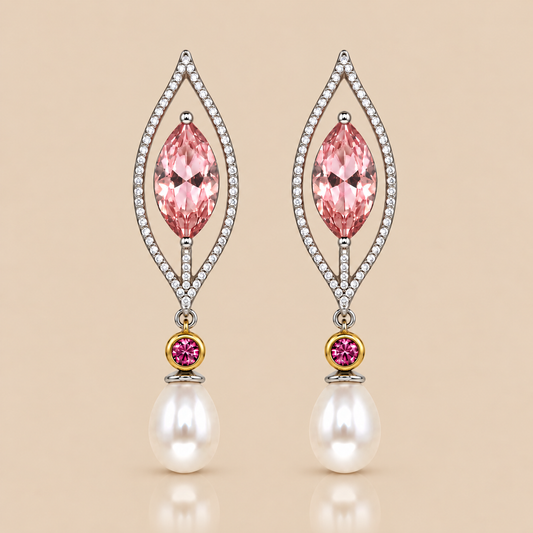 Marquise shaped pink gemstone, surrounded by clear white stones and a pink connector with freshwater pearl drop .